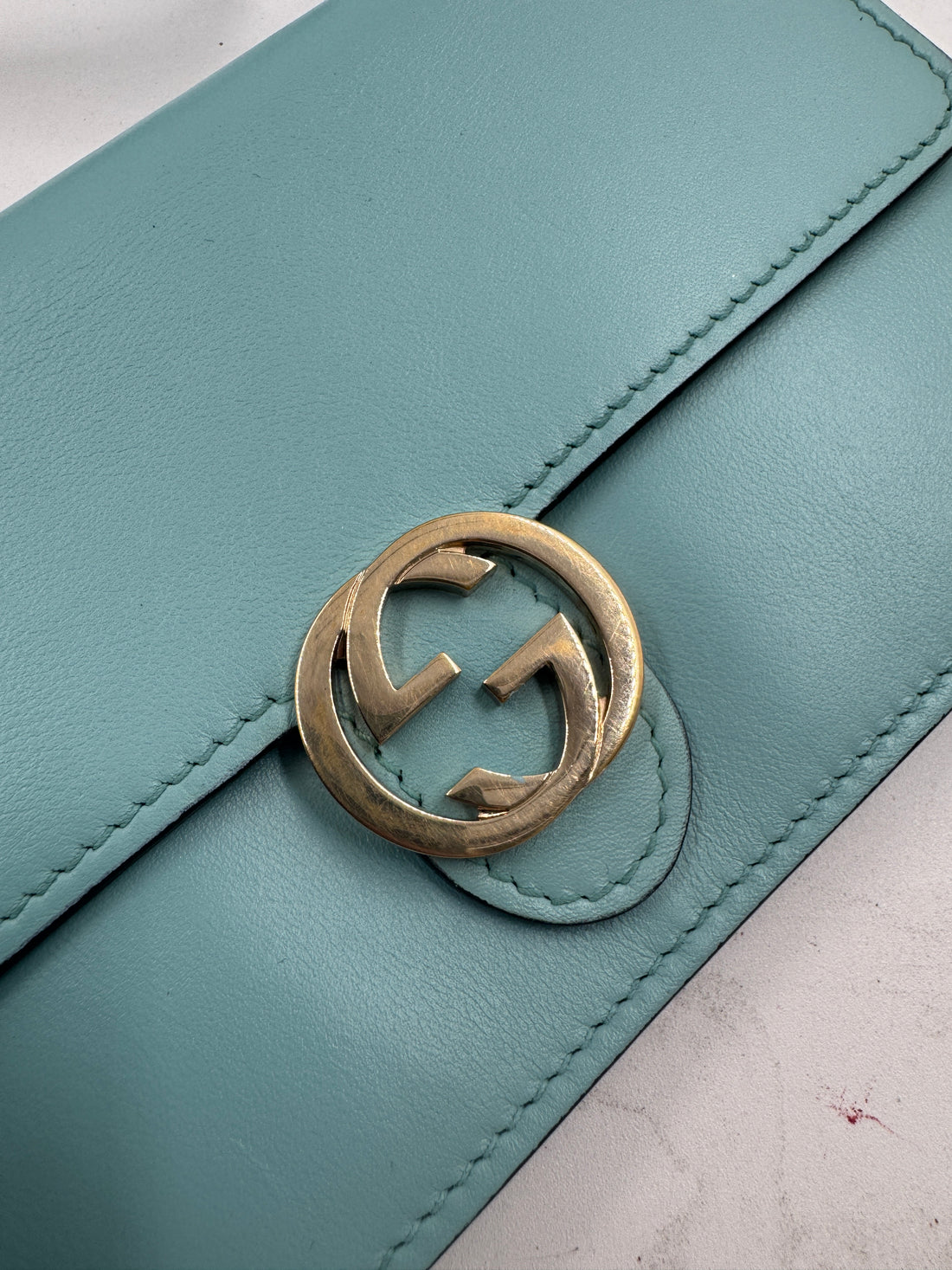 Gucci Marmont Super Mini Bag in a turquoise or light blue color