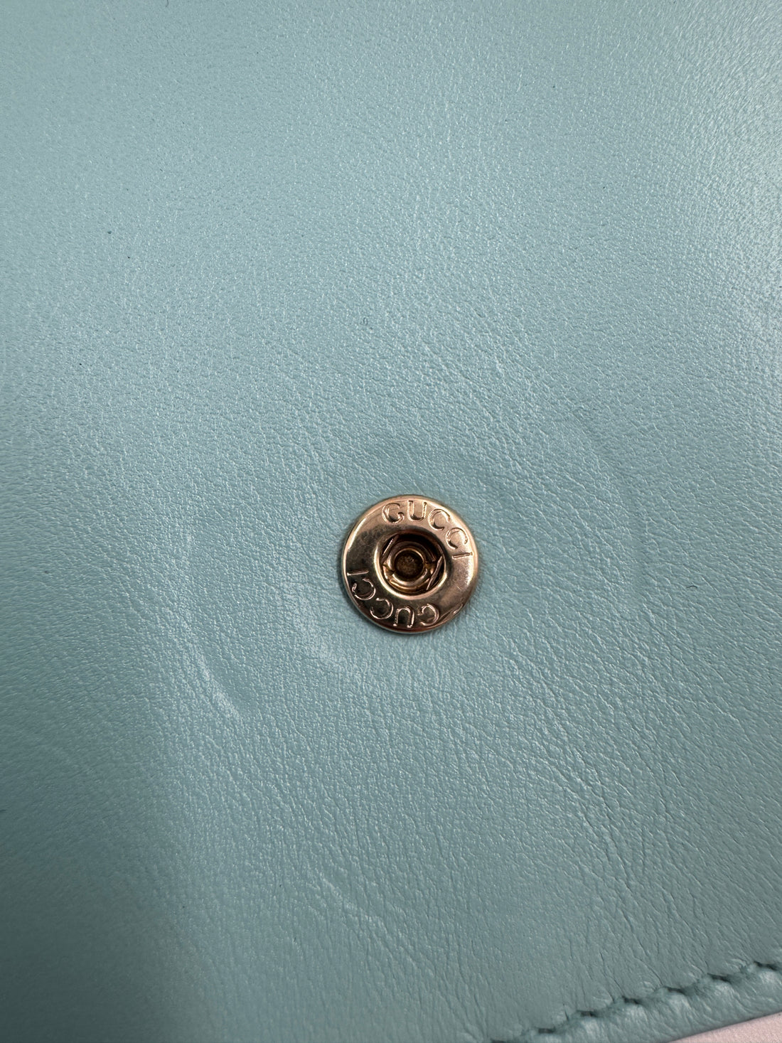 Gucci Marmont Super Mini Bag in a turquoise or light blue color