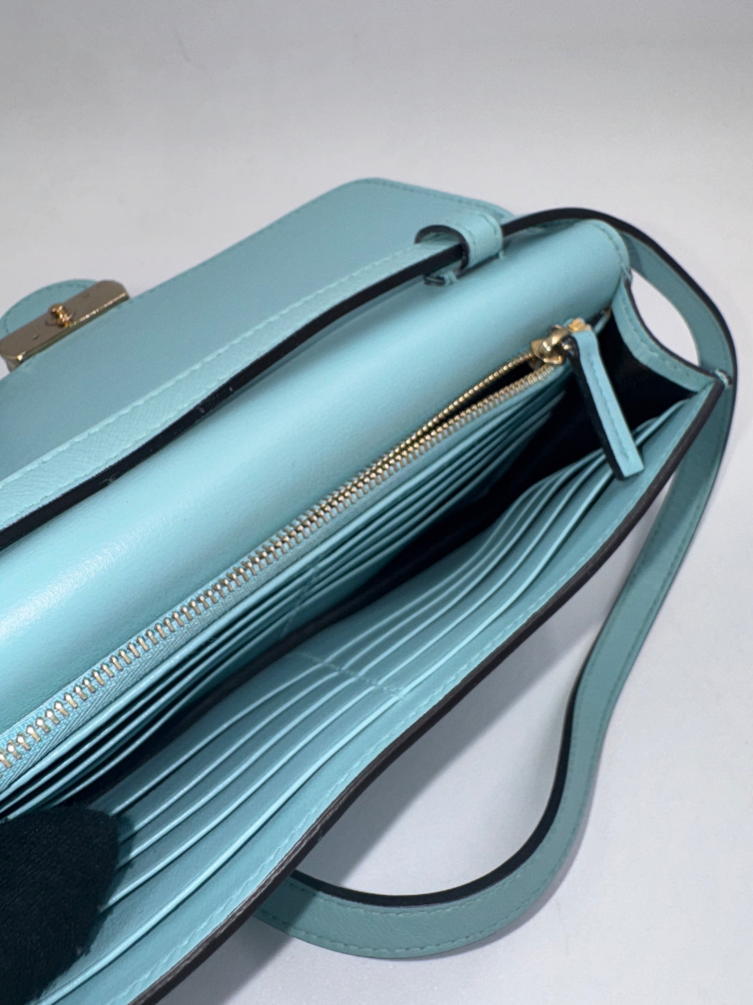 Gucci Marmont Super Mini Bag in a turquoise or light blue color